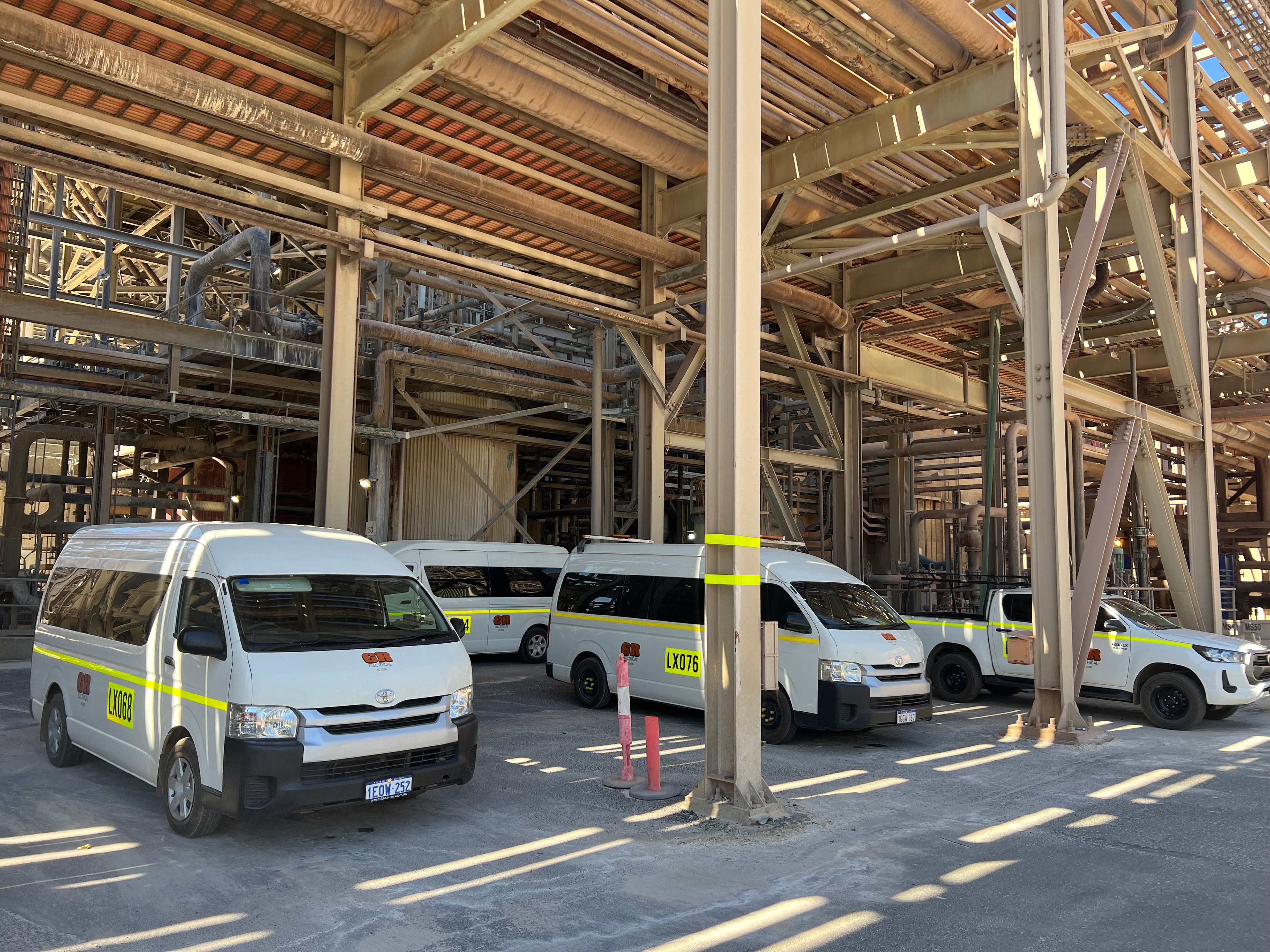 GR Electrical branded vehicles parked inside industrial facility